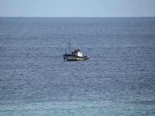 Obraz premium Fishing boat. Calm sea, cold water, suitable for squid fishing.