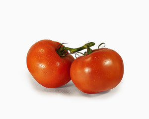 Red tomatoes on a white background. Food, vegetables. Isolate.