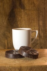 white cup with chocolate on wooden table