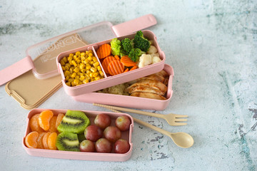 Healthy balanced lunch box on a light background. Home food for office or school. Biodegradable food container with fresh meal