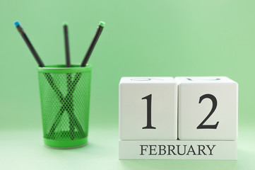 Desk calendar of two cubes for February 12