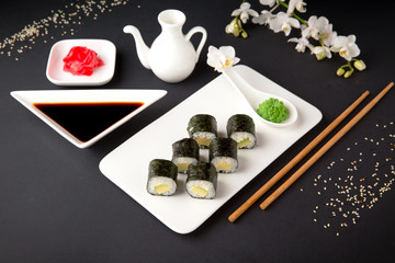 Obraz na płótnie Canvas Maki rolls with avocado and unagi sauce. Sushi menu. Japanese food. 