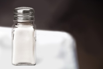 The salt glass bottle on white desk