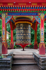 Fototapeta premium Large Buddhist Prayer Wheel. According to the Tibetan Buddhist tradition, spinning such a wheel will have much the same meritorious effect as orally reciting the prayers. 