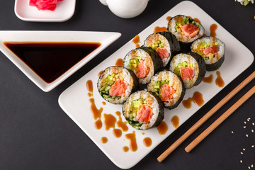 Hot fried Sushi Roll with salmon, tuna, avocado and cheese. Sushi menu. Japanese food.