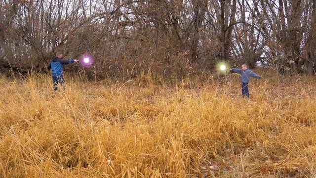 Two young wizards have a magic and duel that ends in a blast that knocks them both out with the shock wave
