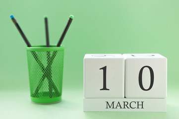 Desk calendar of two cubes for March 10