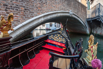 Fototapeta na wymiar View From in Gondola Going Under Arched Brick Bridge in Venice