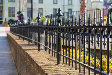 Black Iron Fence along a Small Town Main Street sidewalk.