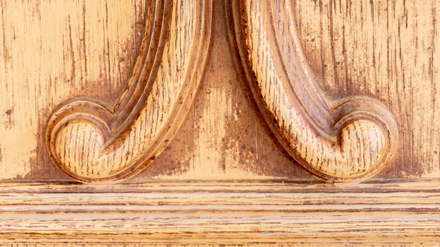 Old traditional moulding design on a plywood bentwood headboard with bevels and curves for traditional design. Useful as a backdrop or sample of furniture design.
