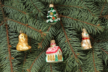 Winter composition - blue spruce tree twigs and toys background