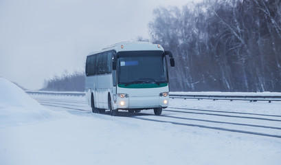 Bus Moves along a Winter Snowy Road