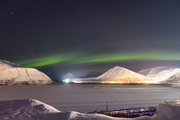 Fototapeta na wymiar Northern lights on the background-night mountains