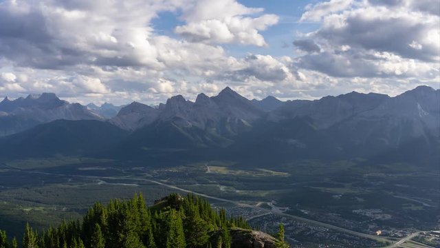 Beautiful Time Lapse View of Canadian Rocky Mountain Landscape during a cloudy and rainy day. Taken from Mt Lady MacDonald, Canmore, Alberta, Canada.