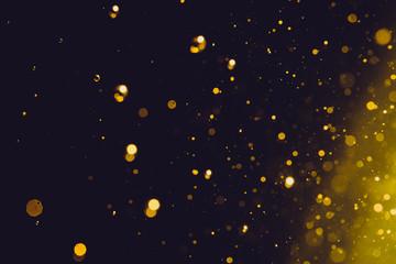 Abstract gold bokeh on black