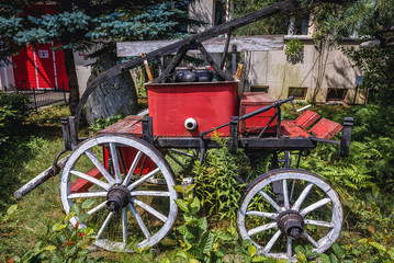Fototapeta premium Historic fire vehicle in front of fire station in Jerzwald, small village in Masuria region of Poland