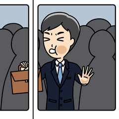 満員電車で通勤する男性会社員