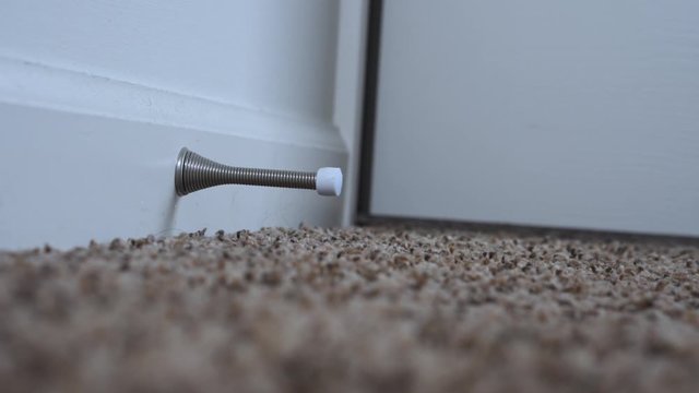 White door slams into a door stopper