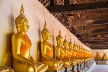 Row of old beautiful meditation Buddha statue