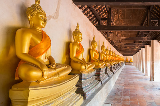 Row of old beautiful meditation Buddha statue