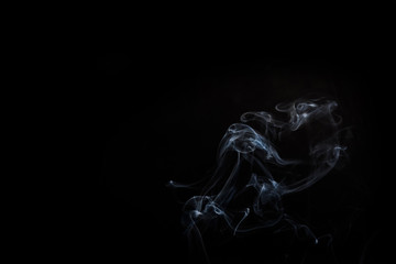 Naklejka premium Abstract smoke swirls on black
