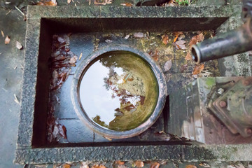 a stone water basin filled with water