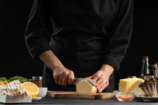 A professional chef prepares a fresh and healthy Italian salad slicing mazzarella cheese, Organic and wholesome food. Healthy nutrition and vitamins. Vegetarian