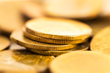 Close up of antique aged golden coin with history on scratch
