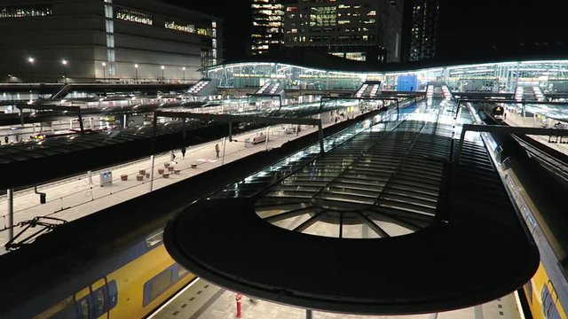 Three trains departing from Utrecht train station in the evening (Timelaspe)