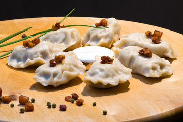 Dumplings with mashed potato, closeup. Pierogi ruskie, z mięsem, kapustą, grzybami. Traditional...