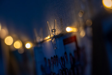 Christmas lights in the night. Photo pinned on the string with the peg - clip.