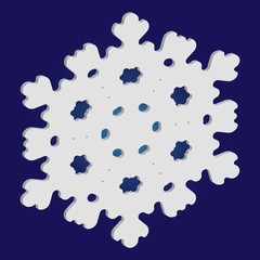 Christmas paper snowflake on blue background.