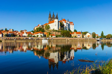 View on the Albrechtsburg castle and the Gothic Meissen Cathedral, the embankment and Elbe river on...