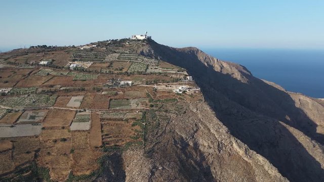 Drone shot of wine making vineyards on top of mountain in Santorini, greece