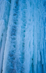 background: ice cascade, waterfall, formed by the low winter temperatures used to climb on ice