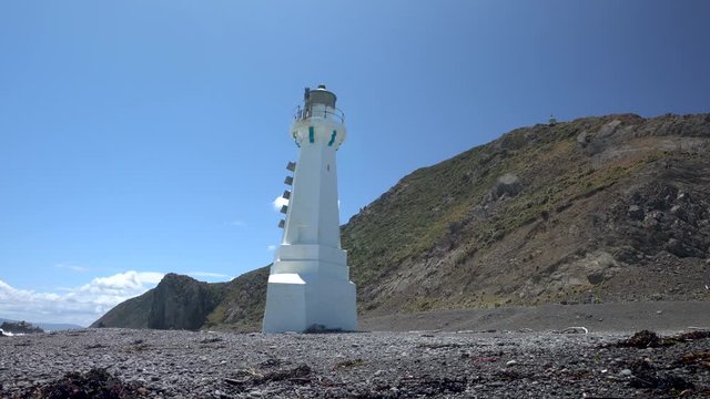 Pencarrow Lighthouse in Wellington New Zealand on a sunny day sliding from left to right
