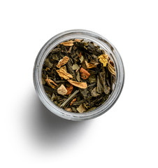 Green tea with aromatic additives. Top view on white background