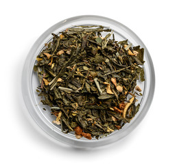 Green tea with aromatic additives. Top view on white background