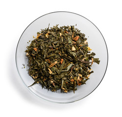 Green tea with aromatic additives. Top view on white background