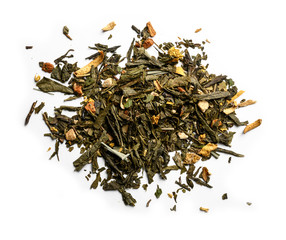 Green tea with aromatic additives. Top view on white background