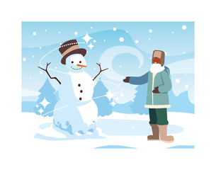 man with snowman in winter landscape