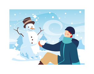 man with snowman in winter landscape