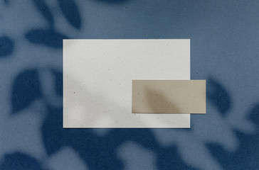 Empty eco paper sheets brown bg shadow overlay