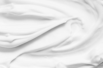 Cosmetic foam lather texture background. White cleanser, shaving foam, shampoo. Foamy skin care...