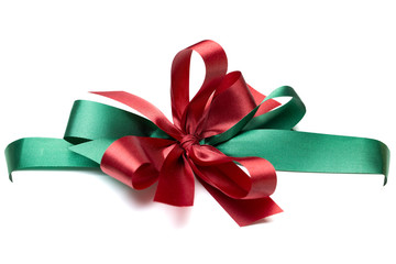 Red and green plaid birthday Christmas gift bow and ribbon with macro detailed on texture.  isolated on a white background with clipping path.