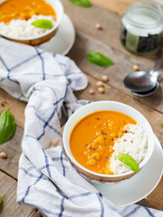 Chickpea Curry in white bowl on wooden table