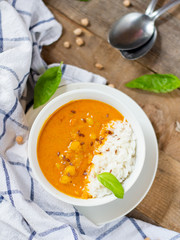 Chickpea Curry in white bowl on wooden table