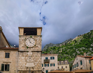 Picturesque City Tower in a cobblestone city square in the Old town of Kotor Montenegro in the Balkans on Adriatic Sea