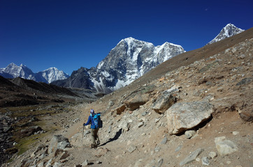 Everest trek, Man hiking in Himalayas with view of Tabuche Peak. Sagarmatha national park, Solukhumbu, Nepal