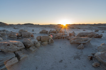 Sun sets over Bisti badlands, De-na-zin wilderness area, New Mexico, USA. Fantastic landscapes.